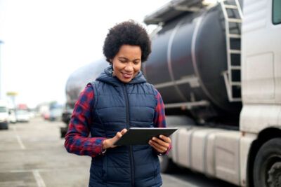 Fleet manager using tablet to track fuel usage and manage fleet operations