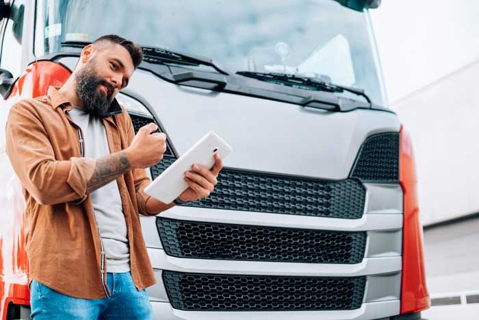 A fleet owner is able to view data on fleet card usage in real-time from his tablet while standing by a truck.